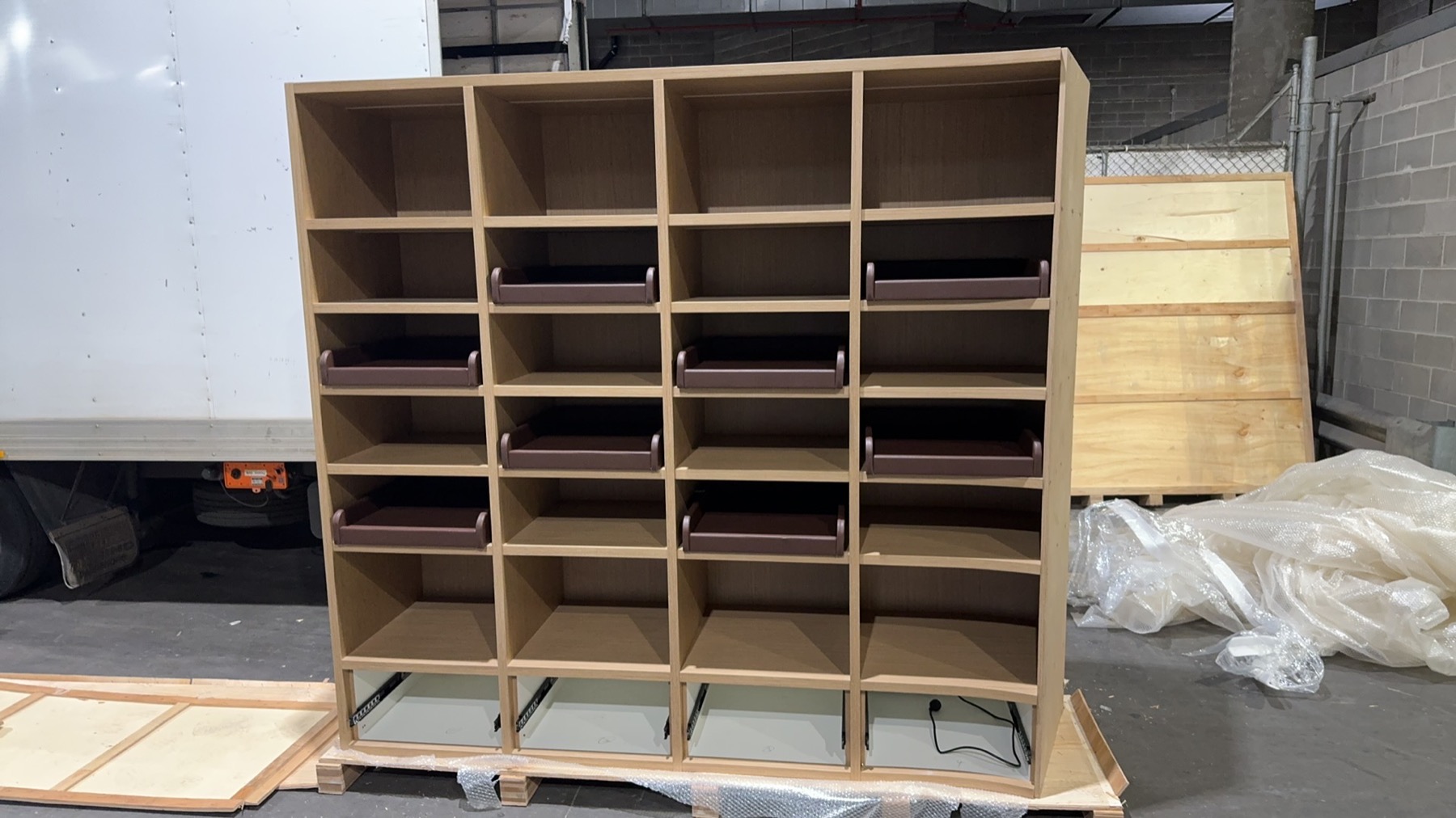 Commercial shelving and office furniture prepared near a truck for a Richmond to Mulgrave 12 tonne Melbourne office relocation