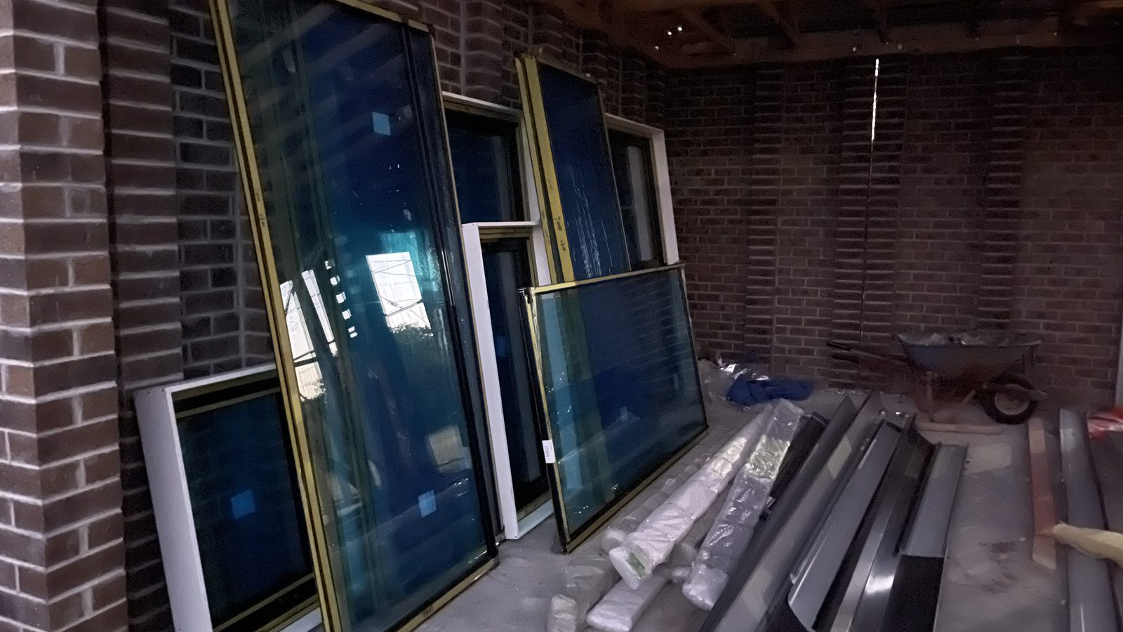 Large framed glass panels staged upright during a real JD Movers job relevant to Alphington moves