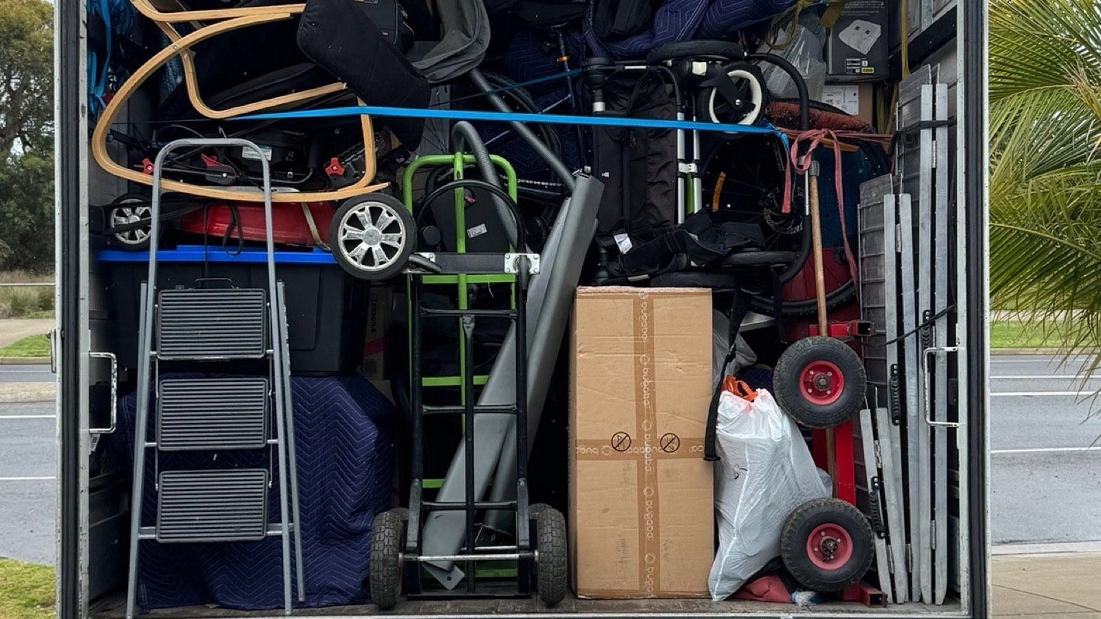 Furniture, cartons, moving blankets and equipment secured inside a JD Movers truck during a separate real residential job, illustrating Box Hill load planning