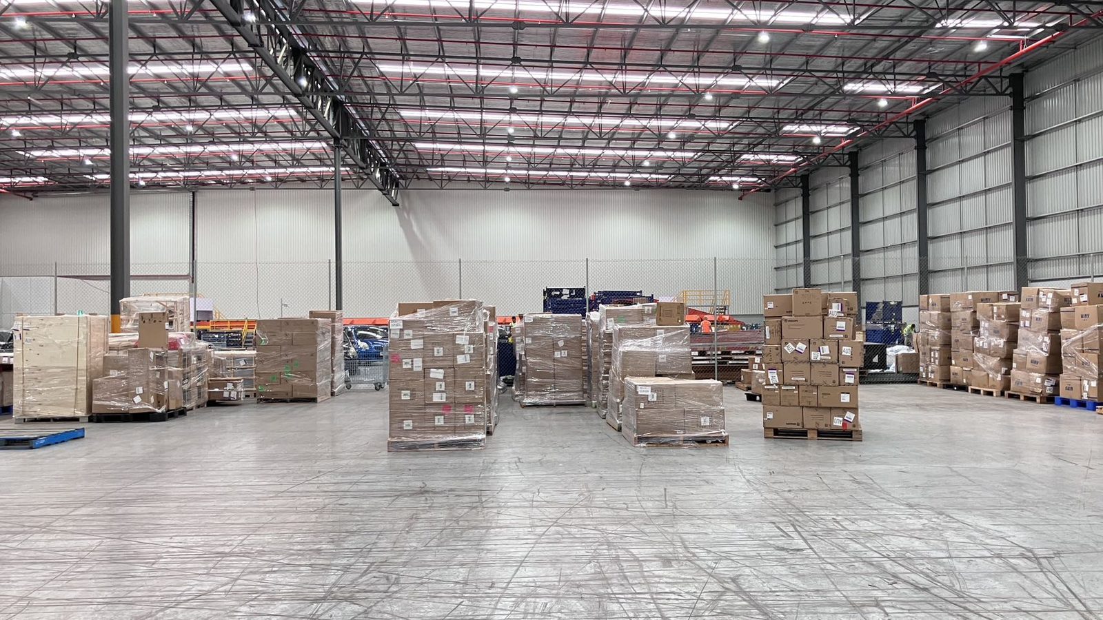 Palletised commercial stock prepared for a Braeside warehouse relocation