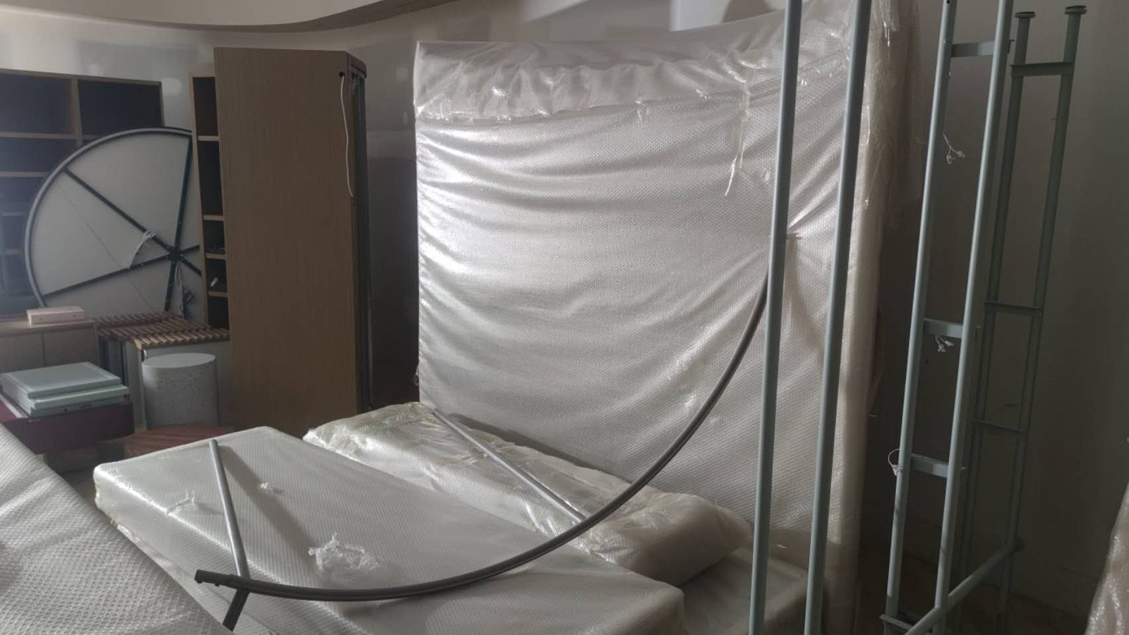 Wrapped cabinets and household furniture prepared for a Burwood East move