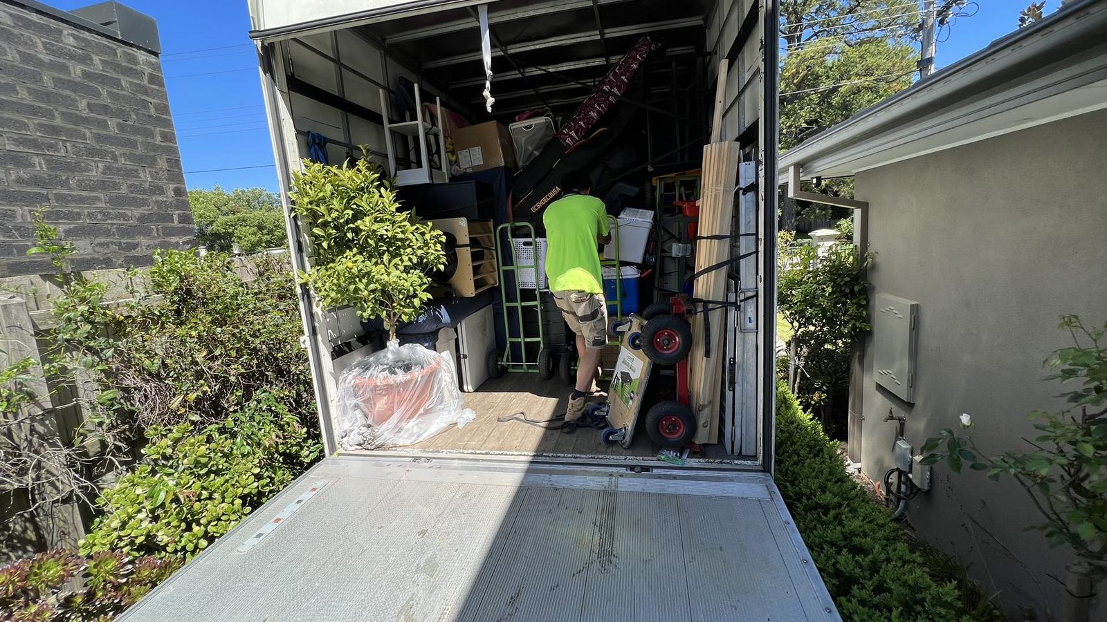 Household furniture and moving equipment organised at the truck during a separate real JD Movers job, illustrating Burwood move preparation