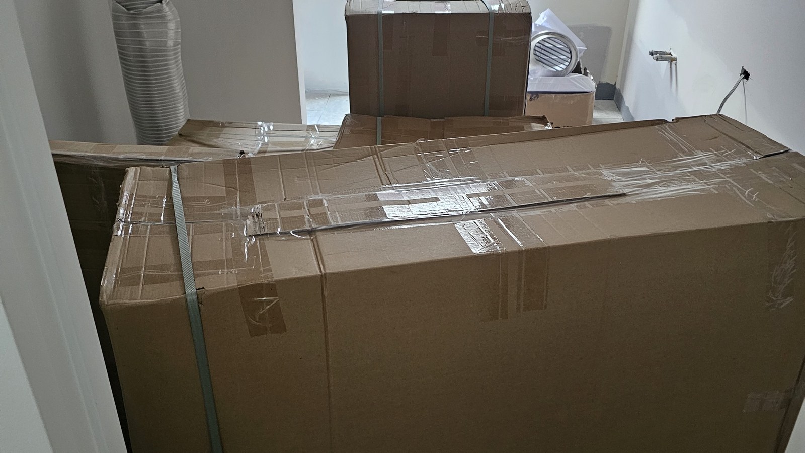 Large boxed household items staged inside a property during a separate real JD Movers job, illustrating Clayton move preparation