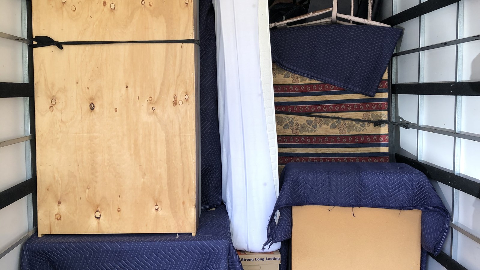 Protected household furniture loaded inside a real JD Movers truck in Melbourne
