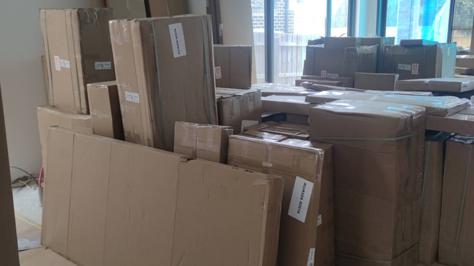 Packed cartons grouped inside a property during a separate real JD Movers job, illustrating Doncaster move preparation