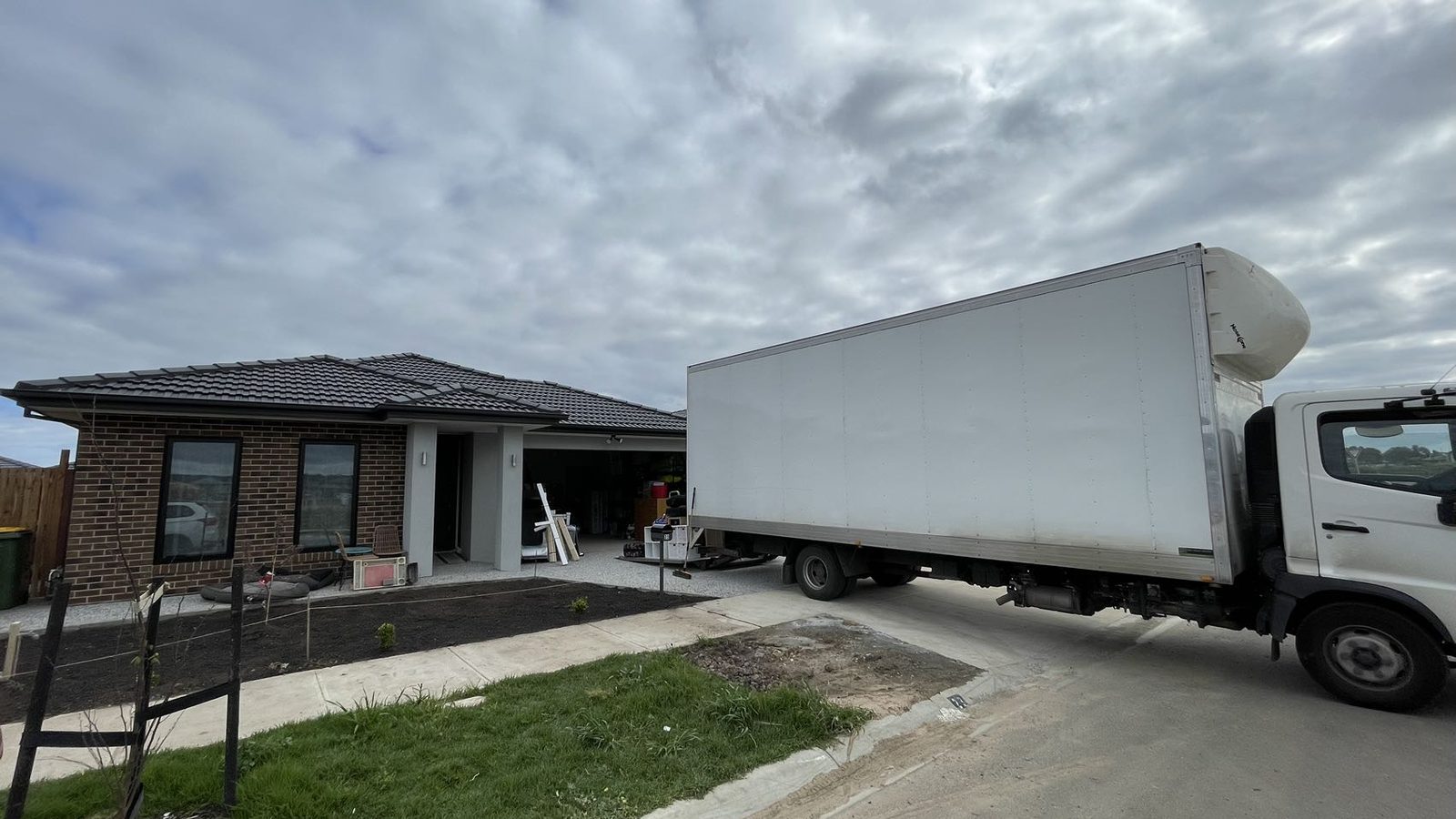 JD Movers truck positioned at a residential property during a real job relevant to Doveton moves