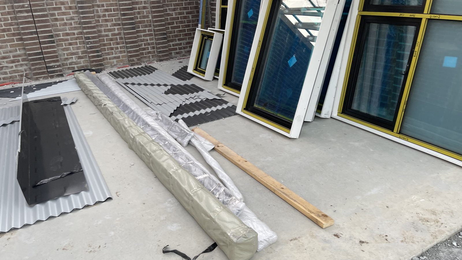 Mixed-size window frames arranged for transport in a real JD Movers job, illustrating Eaglemont move planning