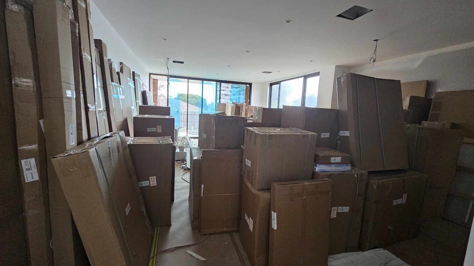 Cartons and furniture prepared inside an apartment during a real JD Movers job, illustrating Hawthorn East moves