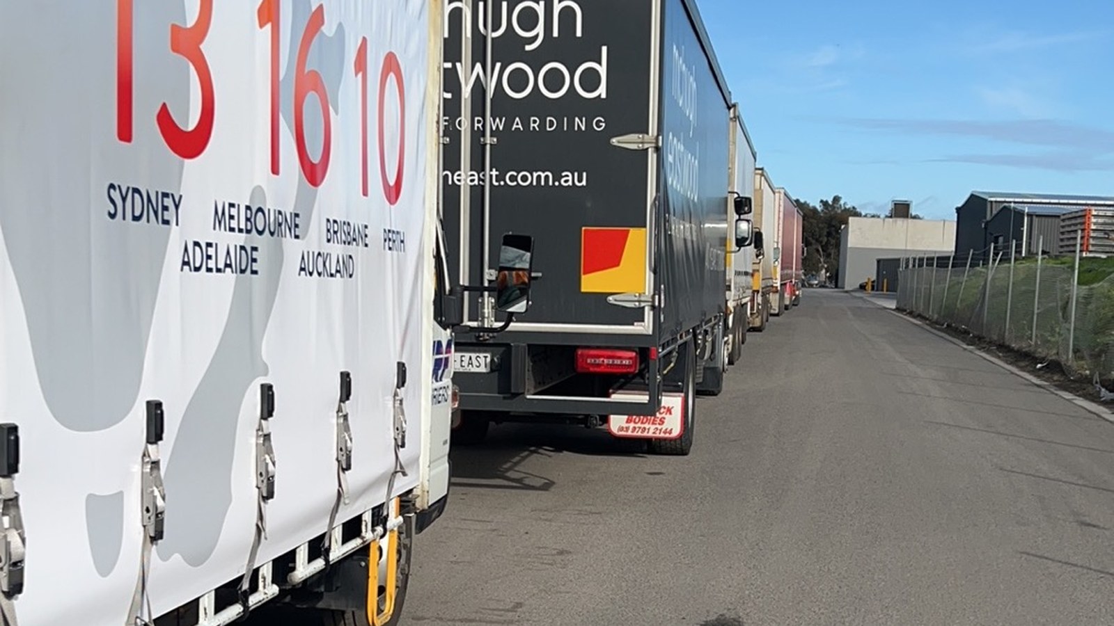 Moving trucks positioned in a constrained access area during a real JD Movers job, illustrating Hughesdale parking planning