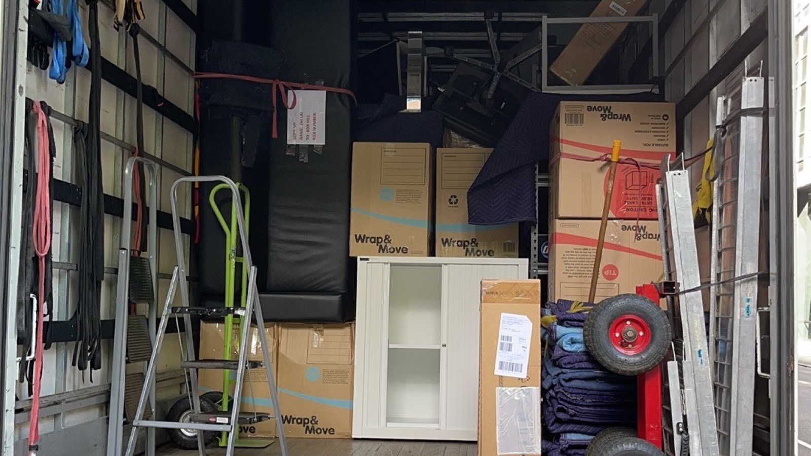 Protected furniture, cartons and moving equipment inside a separate real JD Movers truck load, illustrating Malvern move planning
