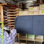 Separate real JD Movers truck load with protected furniture and cartons, illustrating storage move planning