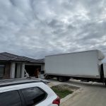 Separate real JD Movers truck positioned at a Melbourne residential pickup, illustrating truck access planning