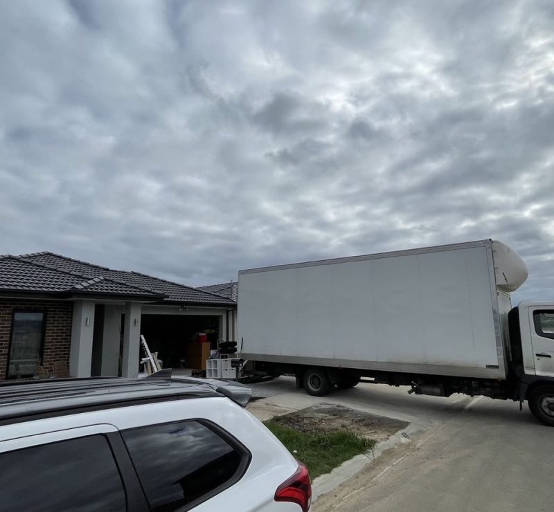 Separate real JD Movers truck positioned at a Melbourne residential pickup, illustrating truck access planning