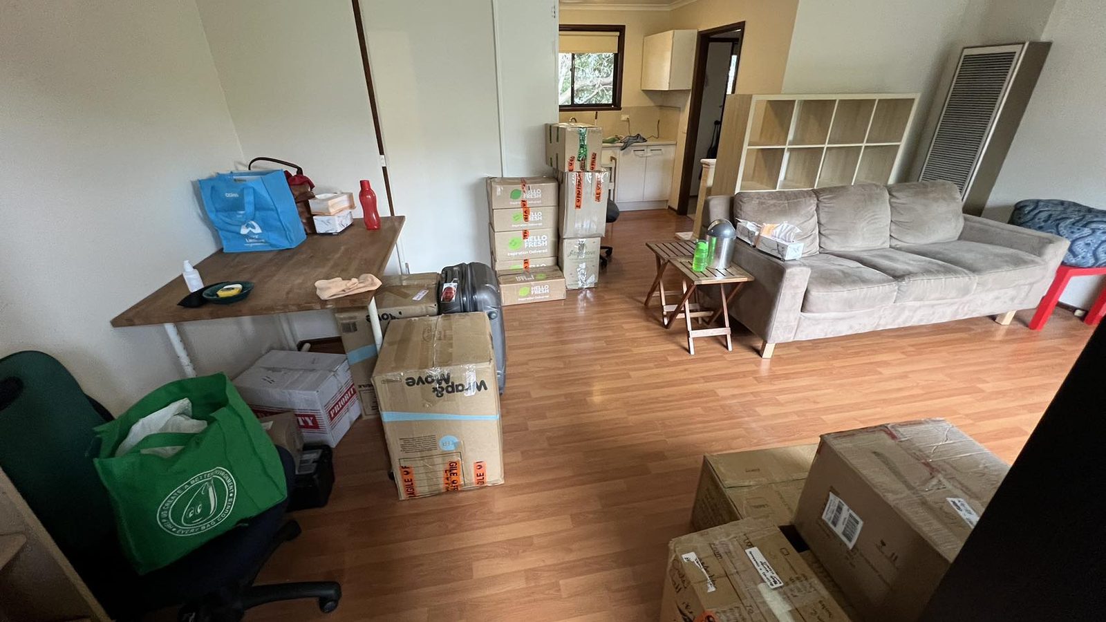 Packed moving boxes and household furniture prepared for an Oakleigh East apartment move by JD Movers
