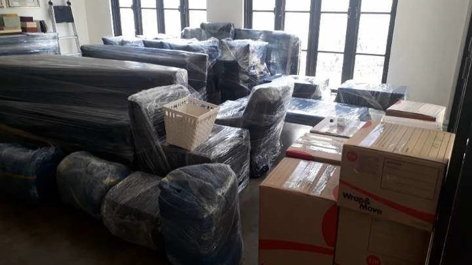 Boxes and household furniture prepared inside a real JD Movers family-home job, illustrating Tarneit moves