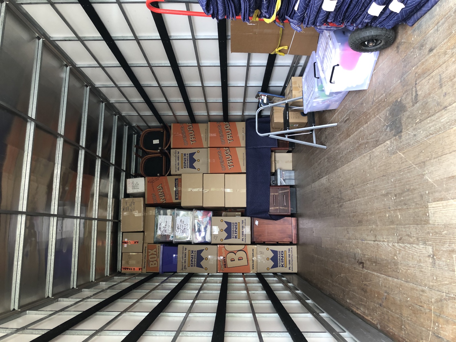 Boxes, protected items and moving blankets inside a separate real JD Movers 12 tonne truck load