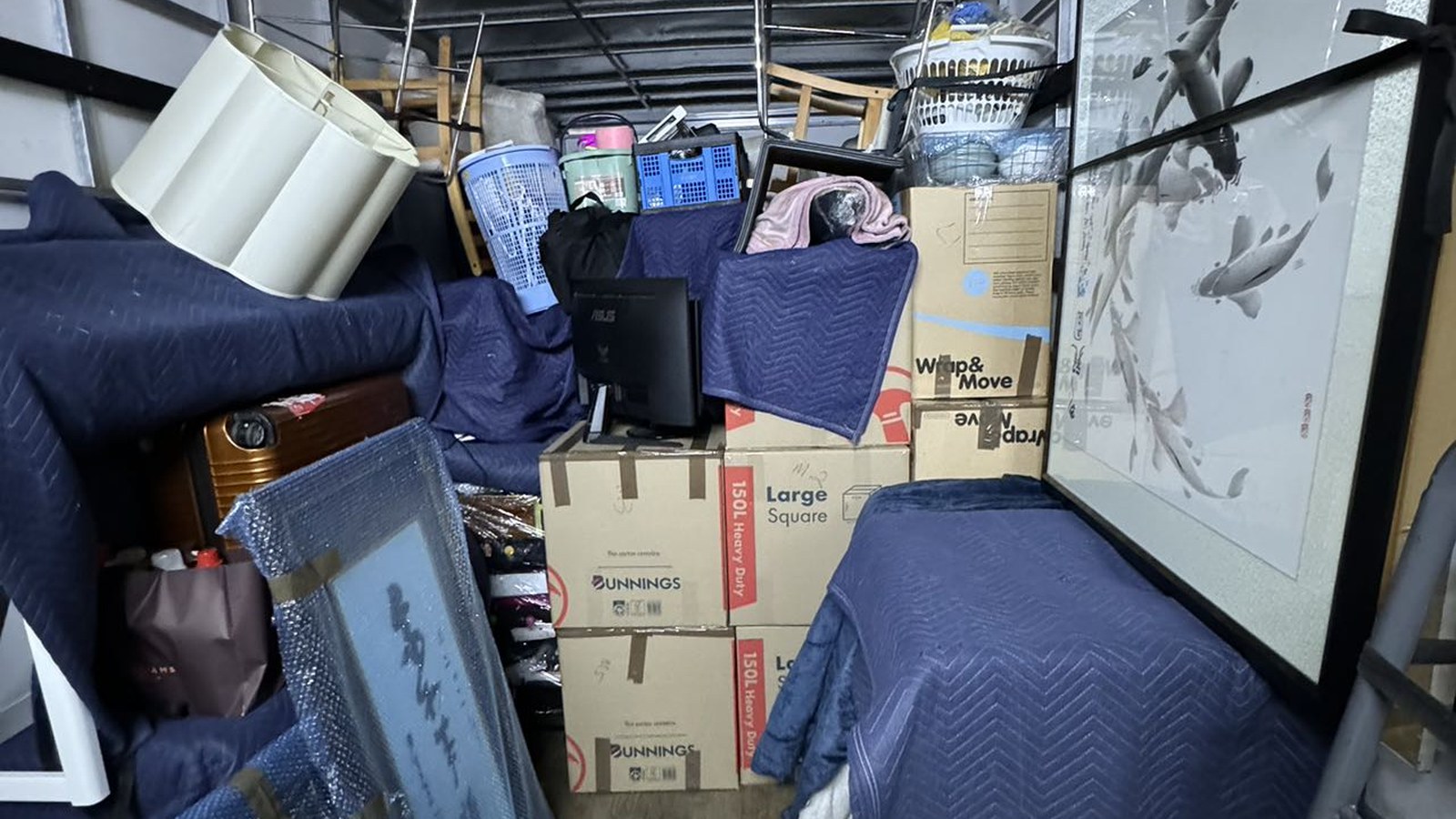 Protected furniture, cartons and fragile flat items loaded inside a real JD Movers truck for Vermont South move planning