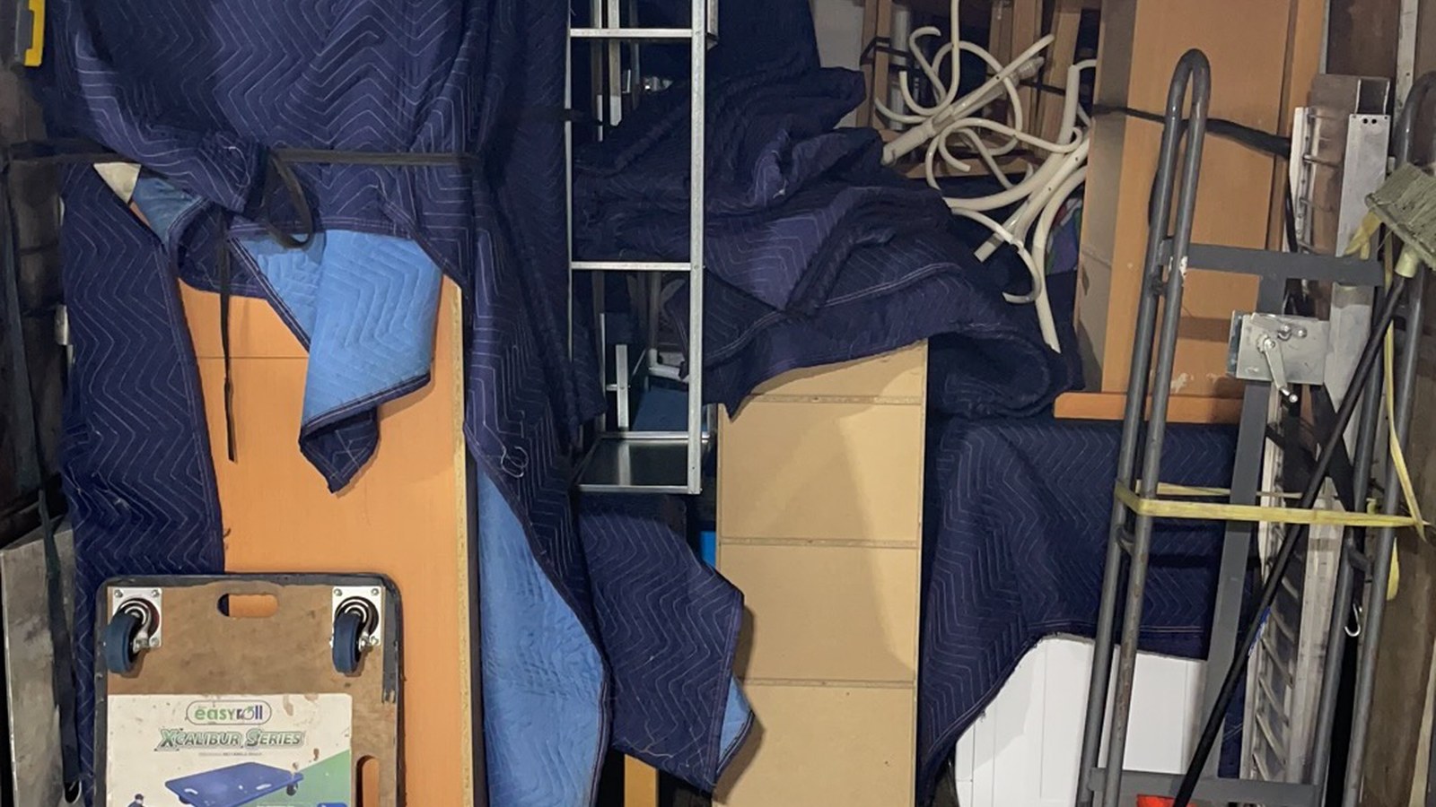 Inside a real JD Movers truck showing protected furniture and boxes arranged for moving-volume planning